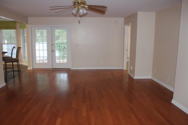 interior space with ceiling fan, dark hardwood / wood-style floors, and french doors