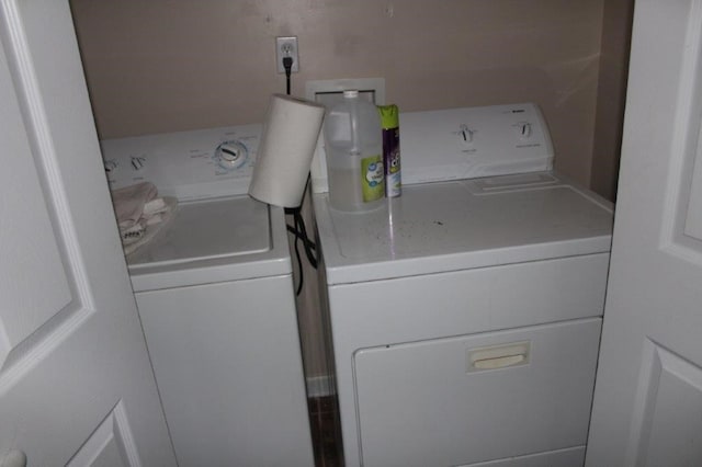 laundry area with separate washer and dryer