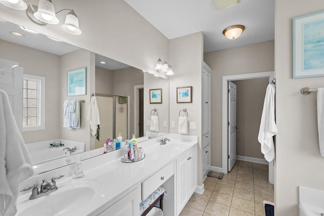 409 Drake Dr, Dothan, AL 36605 - full bath with a stall shower, double vanity, a garden tub, and tile patterned floors