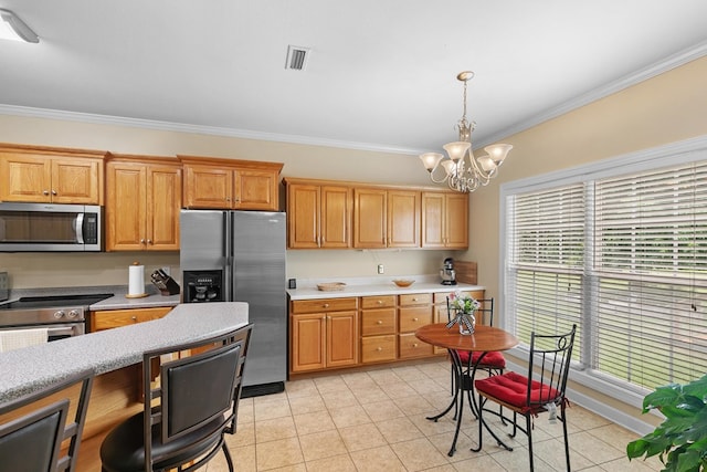 409 Drake Dr, Dothan, AL 36605 - kitchen with stainless steel appliances, ornamental molding, light countertops, decorative light fixtures, and a chandelier
