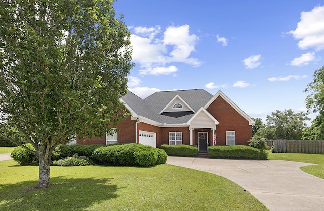 409 Drake Dr, Dothan, AL 36605 - view of front facade featuring brick siding, a garage, and driveway