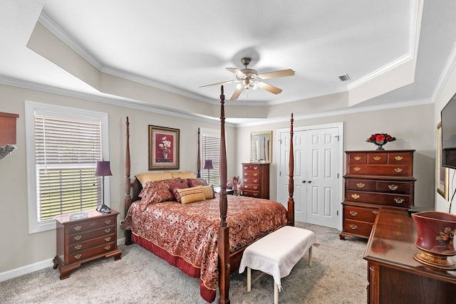 409 Drake Dr, Dothan, AL 36605 - carpeted bedroom with a tray ceiling, ornamental molding, a closet, and a ceiling fan