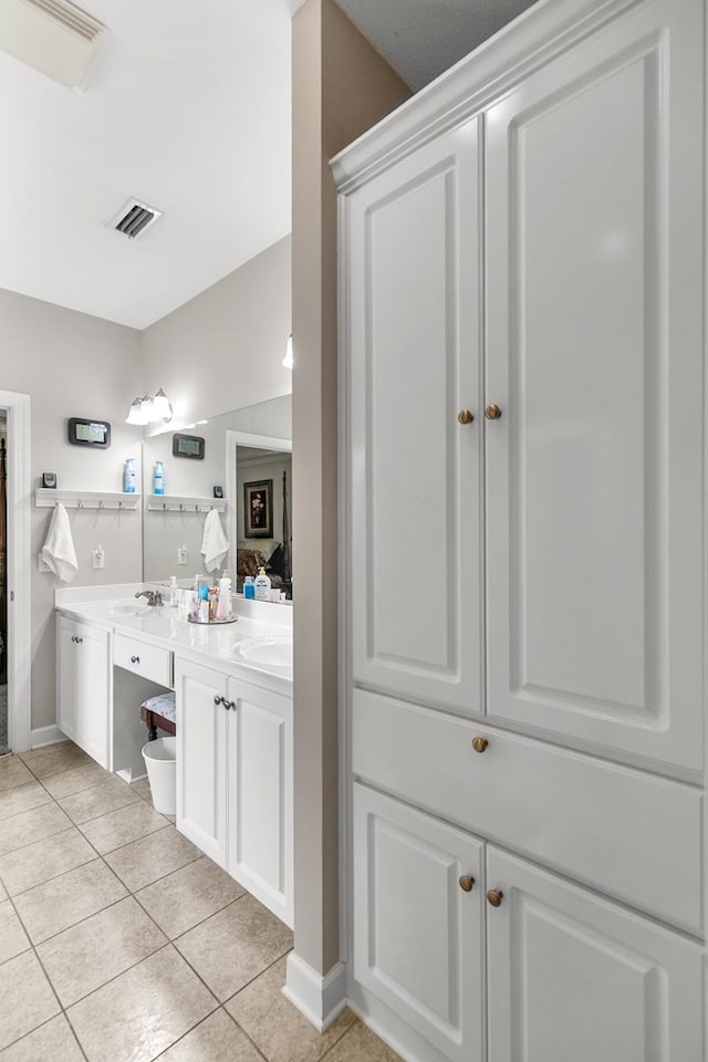 409 Drake Dr, Dothan, AL 36605 - full bath with tile patterned floors and double vanity