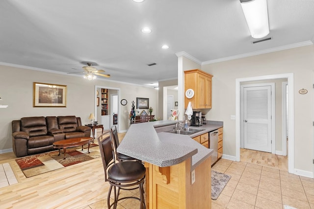 409 Drake Dr, Dothan, AL 36605 - kitchen with dishwasher, ornamental molding, a kitchen bar, light brown cabinetry, and a peninsula