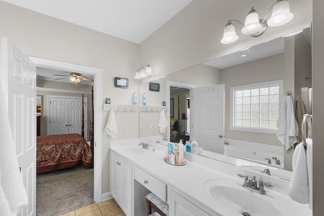 409 Drake Dr, Dothan, AL 36605 - bathroom featuring connected bathroom, double vanity, tile patterned flooring, and a bath