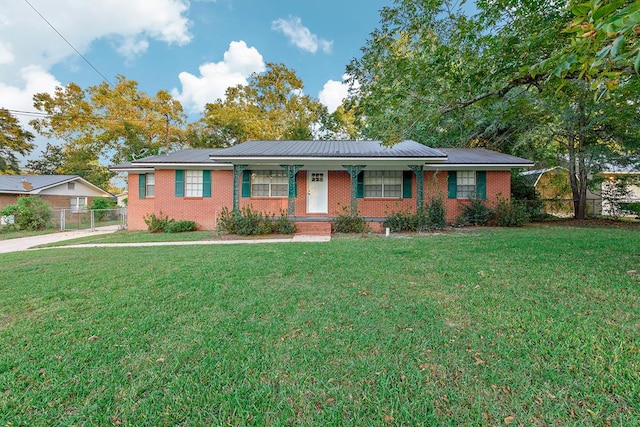 ranch-style house with covered porch and a front yard