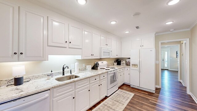 180 Fairway Woods Dr, Ozark, AL 36360 - kitchen featuring white appliances, a sink, ornamental molding, dark wood-type flooring, and white cabinetry