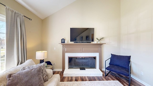 180 Fairway Woods Dr, Ozark, AL 36360 - living area featuring vaulted ceiling, wood finished floors, a fireplace, and baseboards