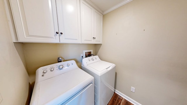 180 Fairway Woods Dr, Ozark, AL 36360 - laundry area featuring cabinet space, washer and clothes dryer, dark wood-style flooring, ornamental molding, and baseboards