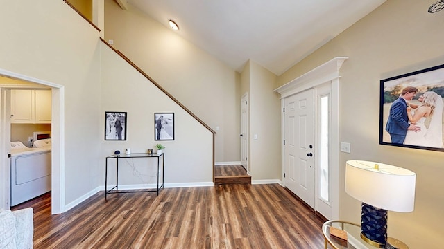 180 Fairway Woods Dr, Ozark, AL 36360 - foyer with wood finished floors, baseboards, separate washer and dryer, and high vaulted ceiling