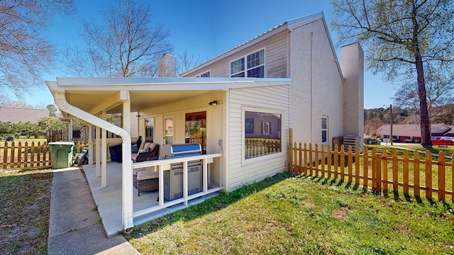 180 Fairway Woods Dr, Ozark, AL 36360 - back of house with a chimney and a patio area