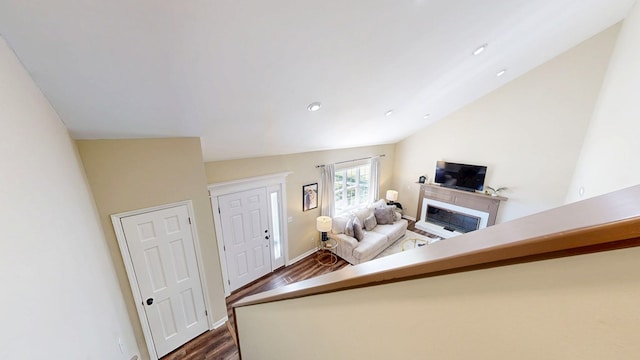 180 Fairway Woods Dr, Ozark, AL 36360 - living area featuring dark wood finished floors, a fireplace, baseboards, vaulted ceiling, and recessed lighting
