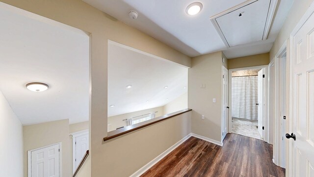 180 Fairway Woods Dr, Ozark, AL 36360 - hallway featuring attic access, dark wood finished floors, and baseboards