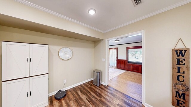 180 Fairway Woods Dr, Ozark, AL 36360 - corridor with dark wood-type flooring, crown molding, and baseboards