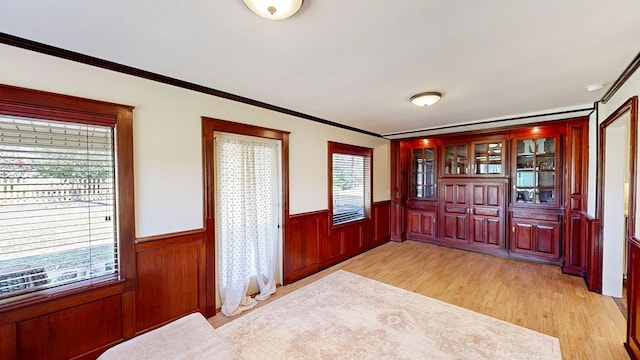 180 Fairway Woods Dr, Ozark, AL 36360 - foyer entrance featuring light wood-style flooring, wainscoting, and ornamental molding