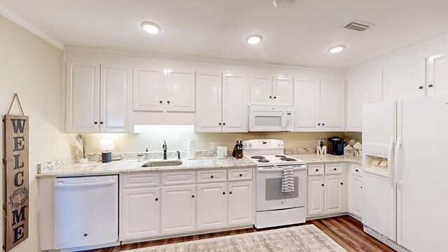 180 Fairway Woods Dr, Ozark, AL 36360 - kitchen with white appliances, a sink, white cabinetry, dark wood finished floors, and ornamental molding