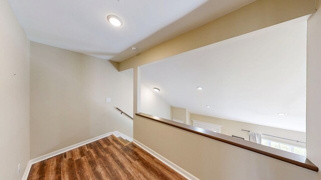 180 Fairway Woods Dr, Ozark, AL 36360 - hall featuring an upstairs landing, wood finished floors, baseboards, and recessed lighting