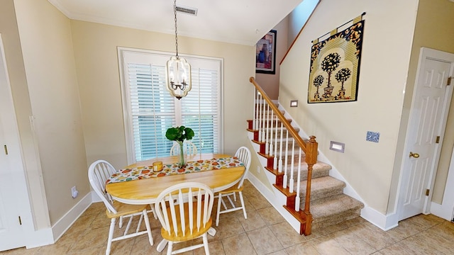 tiled dining space featuring a notable chandelier