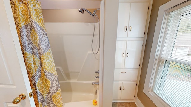 bathroom featuring shower / tub combo with curtain