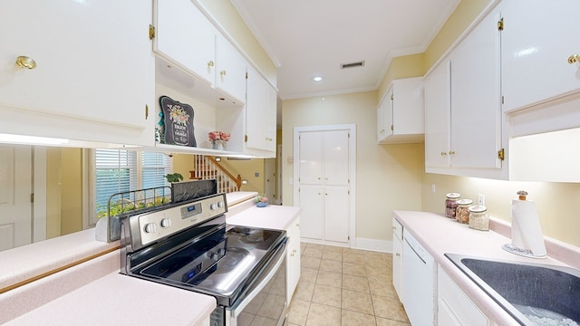 kitchen featuring white cabinets, stainless steel range with electric stovetop, crown molding, and light tile patterned flooring