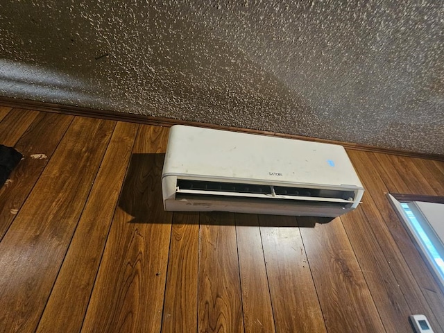 details featuring wood walls and a wall mounted air conditioner