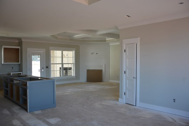 kitchen with a large fireplace, crown molding, and coffered ceiling