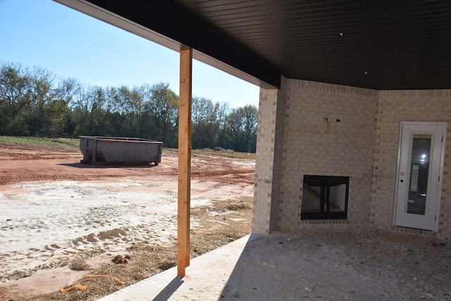 view of patio / terrace with a hot tub