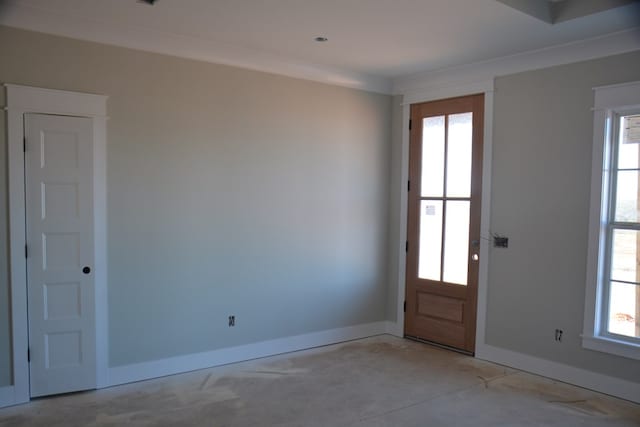 foyer featuring crown molding