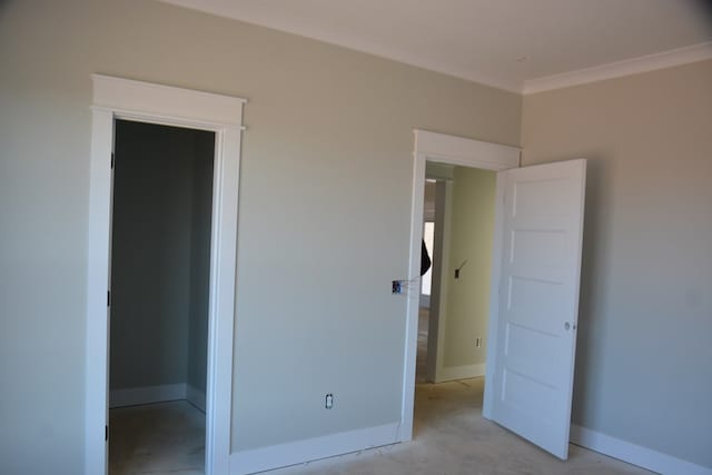 unfurnished bedroom with ornamental molding