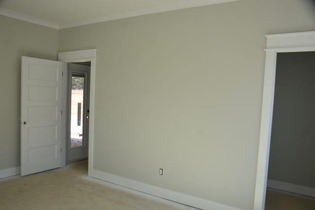 unfurnished room featuring ornamental molding