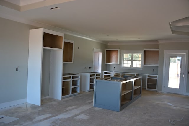 kitchen featuring a center island and ornamental molding