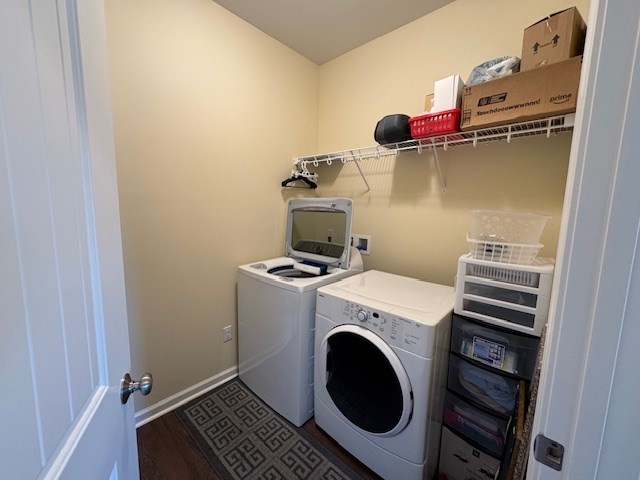 70 Beckett Ln, Newton, AL 36352 - laundry room featuring separate washer and dryer, wood finished floors, and baseboards