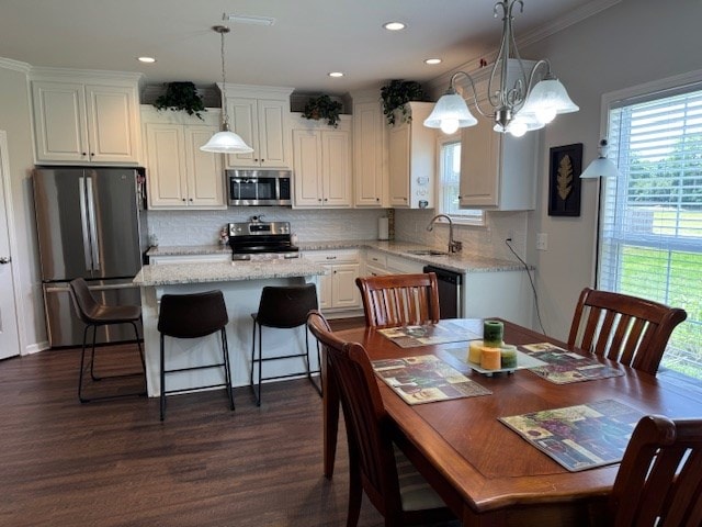 70 Beckett Ln, Newton, AL 36352 - kitchen featuring stainless steel appliances, a sink, a center island, dark wood finished floors, and recessed lighting