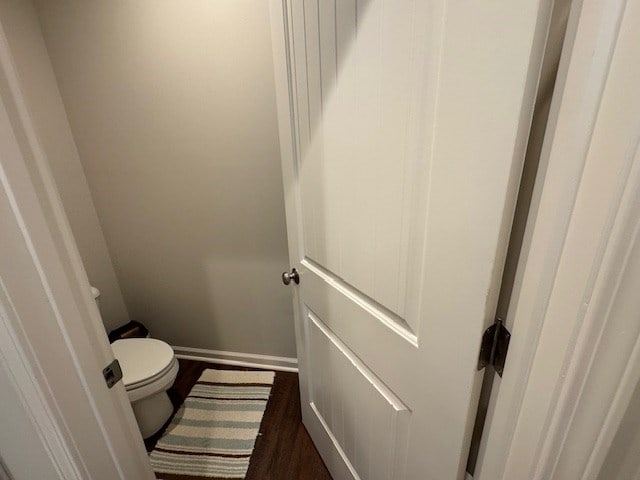 70 Beckett Ln, Newton, AL 36352 - bathroom featuring wood finished floors, toilet, and baseboards