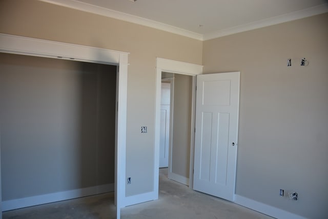 unfurnished bedroom featuring a closet, concrete floors, and ornamental molding