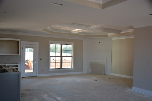 unfurnished living room featuring a large fireplace, coffered ceiling, and ornamental molding