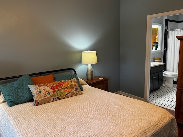117 Lawrenceburg Ct, Dothan, AL 36305 - bedroom with connected bathroom and baseboards