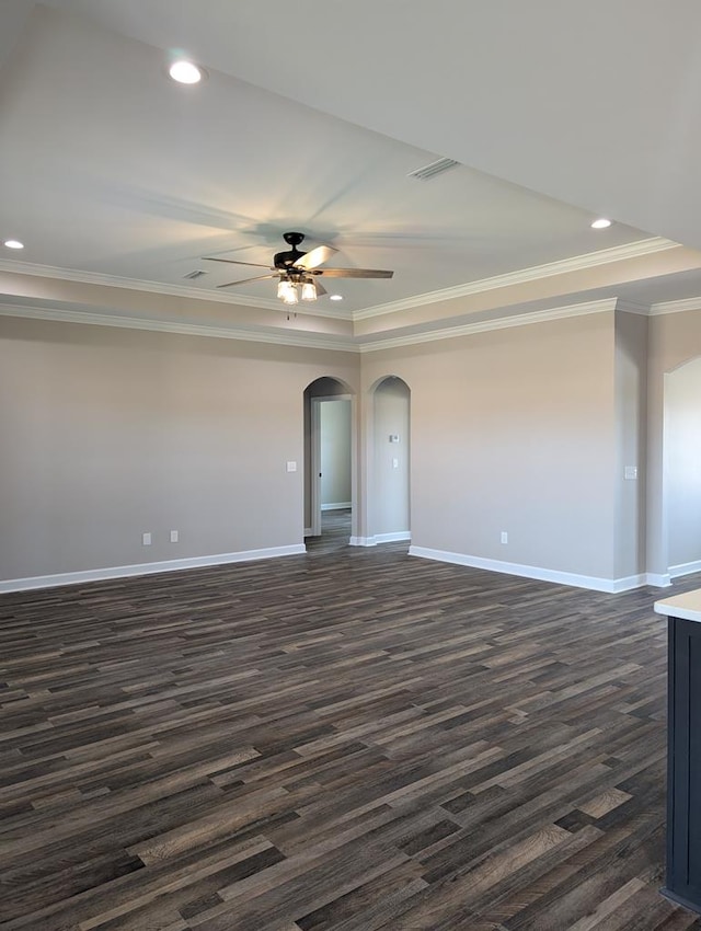 12611 Fortner St, Newton, AL 36352 - unfurnished room featuring baseboards, dark wood finished floors, ornamental molding, arched walkways, and ceiling fan