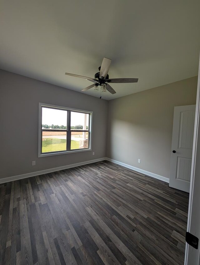 12611 Fortner St, Newton, AL 36352 - empty room with dark wood finished floors, baseboards, and ceiling fan