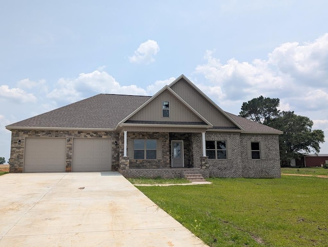 12611 Fortner St, Newton, AL 36352 - craftsman house with an attached garage, a front lawn, concrete driveway, a porch, and a shingled roof