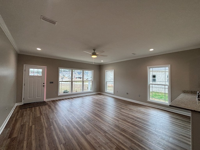 interior space with crown molding, dark hardwood / wood-style floors, and ceiling fan