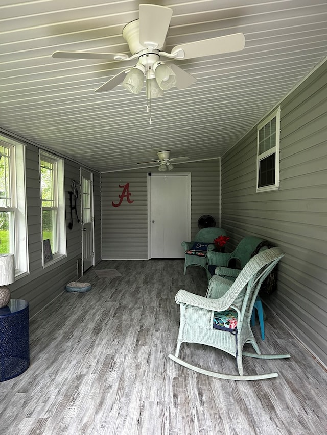 wooden deck featuring ceiling fan