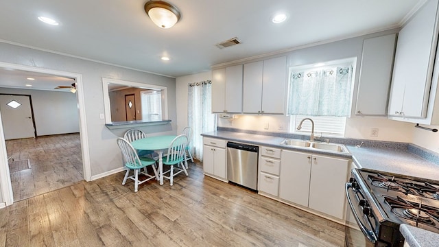 kitchen featuring black range with gas cooktop, sink, light wood-type flooring, dishwasher, and white cabinets