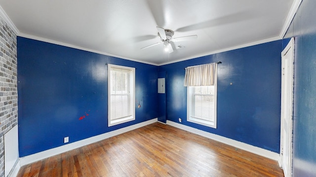 unfurnished room featuring ornamental molding, hardwood / wood-style floors, and ceiling fan