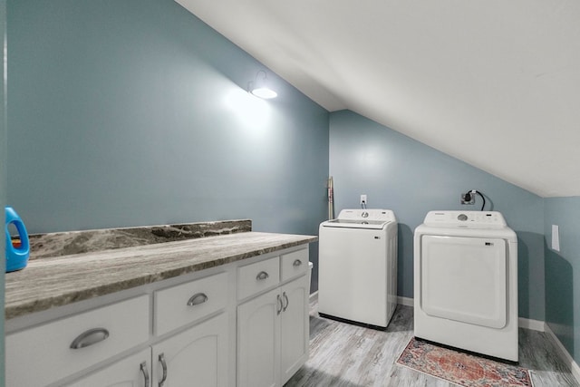 8165 County Road 97, Abbeville, AL 36310 - laundry area with washing machine and dryer, light wood-style floors, and baseboards