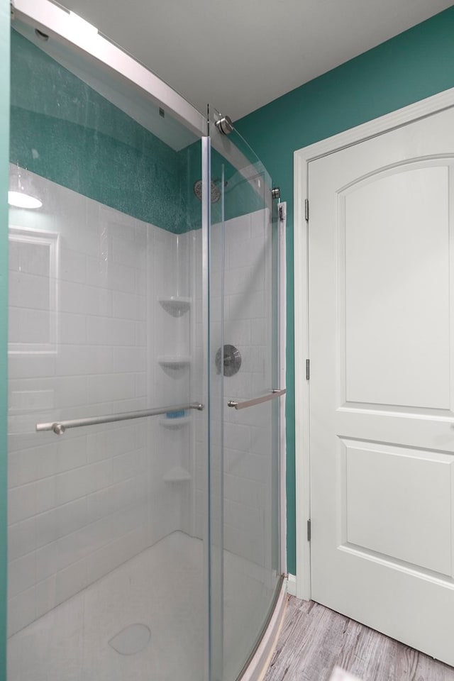 8165 County Road 97, Abbeville, AL 36310 - bathroom featuring a stall shower and wood finished floors