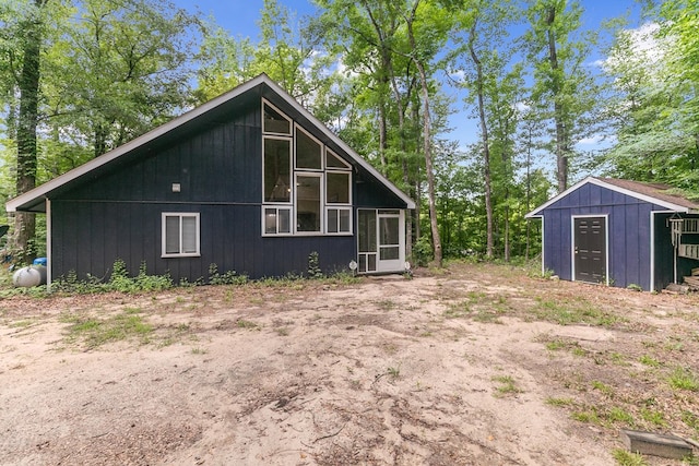 8165 County Road 97, Abbeville, AL 36310 - view of home's exterior with a sunroom