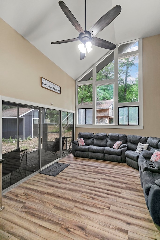 8165 County Road 97, Abbeville, AL 36310 - living area featuring a ceiling fan, wood finished floors, healthy amount of natural light, and high vaulted ceiling