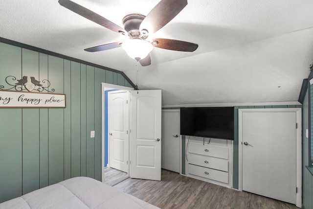 8165 County Road 97, Abbeville, AL 36310 - bedroom with wood finished floors, a textured ceiling, and a ceiling fan