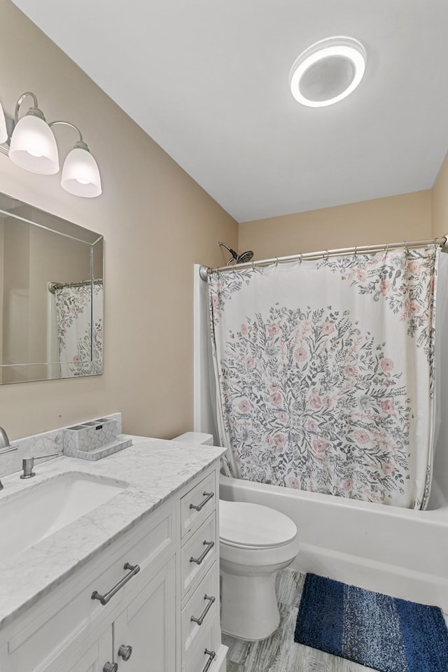 8165 County Road 97, Abbeville, AL 36310 - bathroom featuring vanity, toilet, shower / bath combination with curtain, and wood finished floors
